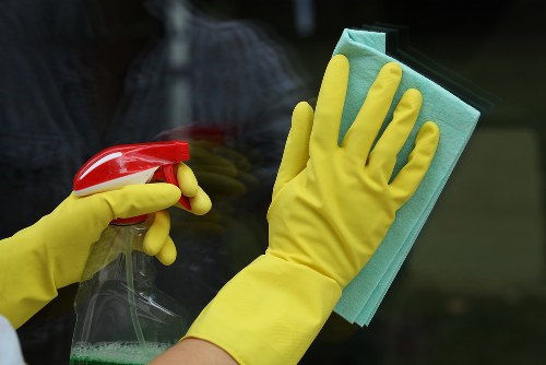Professional facade cleaning on a building exterior in Nw10