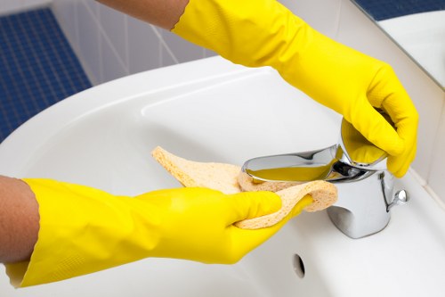 Office cleaners in NW10 sanitising a meeting room